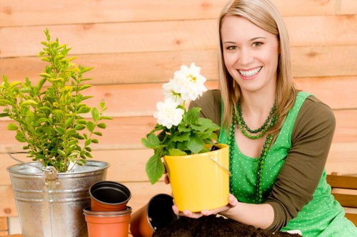 Volunteer gardener tending raised beds in a Crouch End garden